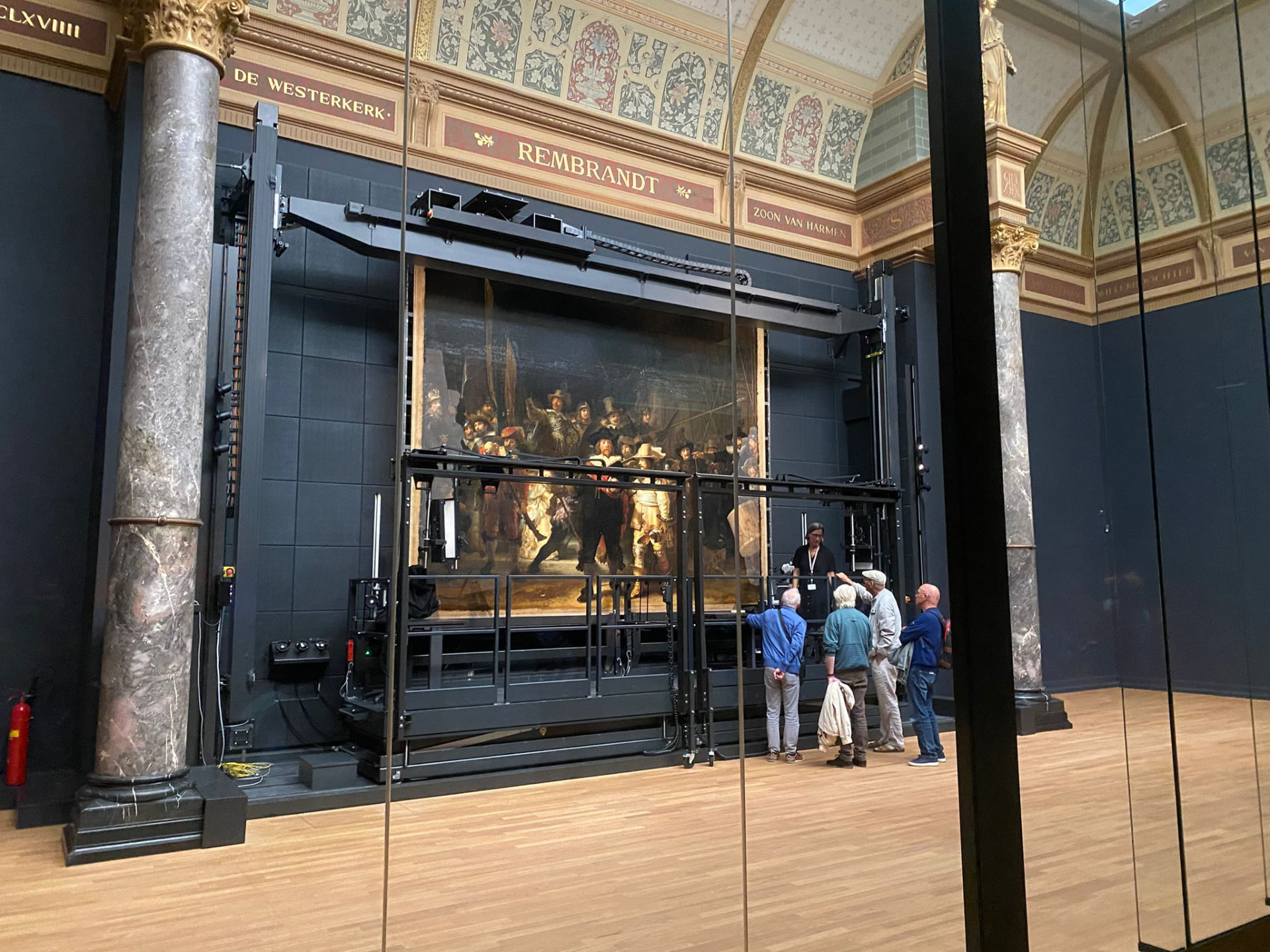 The Night Watch displayed during work in the museum gallery